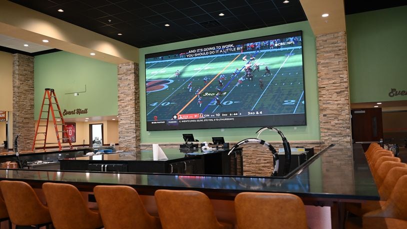 Shooters Sports Grill is about two weeks away from opening. Pictured here is the new sports bar on Thursday, May 16, 2024, on NW Washington Boulevard. Pictured is the 10-foot-by-20-foot television Todd and Alison Helton call the Hamilton Jumbotron. MICHAEL D. PITMAN/STAFF