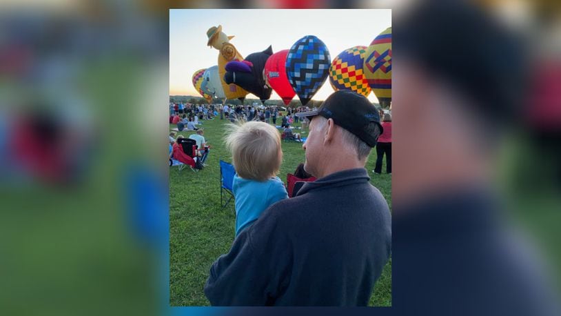 David Hiteshew and his grandson watch hot air balloons rise during The Ohio Challenge in Middletown. iSTOCK/COX