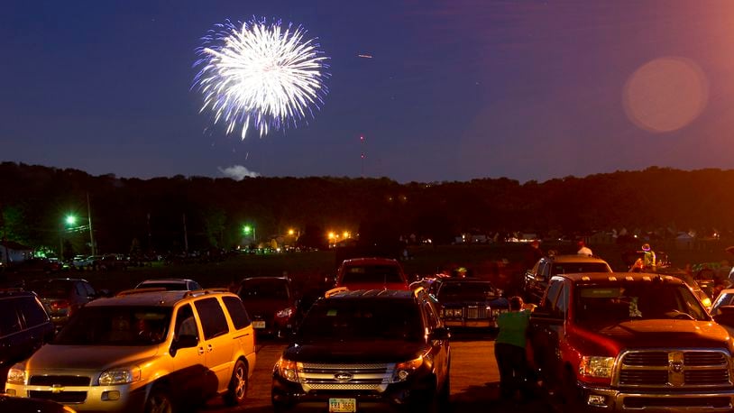 There are several events happening in Butler County for the July 4 holiday. Spectators watch from Fairfield West Baptist Church as fireworks fill the sky in Fairfield during the Red White and Kaboom celebration, July 3, 2014. GREG LYNCH/STAFF