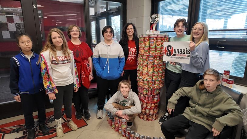 A local food pantry is teaming with dozens of Lakota school students to transform canned goods into sculptures. The second annual “Can Creations” contest sponsored by the school district’s largest, charitable food pantry Reach Out Lakota will soon be judging student-created sculptures made from their families’ donated canned goods at various schools. Pictured are Ridge Junior School students and their Stanley tumbler sculpture. CONTRIBUTED