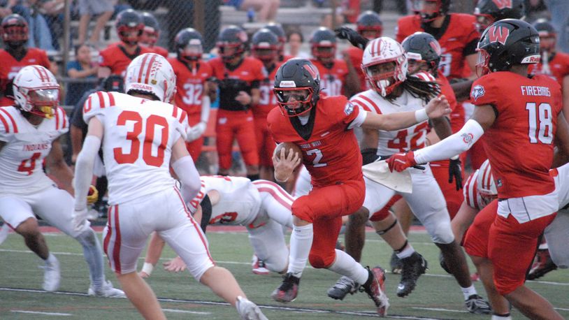 Lakota West's Sam Wiles (2) looks for running room against Fairfield on Friday night. Chris Vogt/CONTRIBUTED