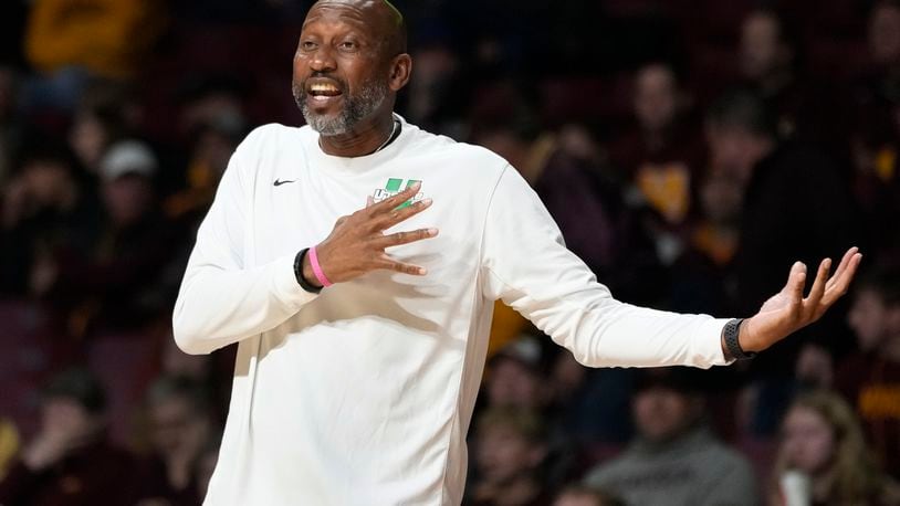 USC Upstate head coach Dave Dickerson gestures toward a referee during the first half of an NCAA college basketball game against Minnesota, Saturday, Nov. 18, 2023, in Minneapolis. (AP Photo/Abbie Parr)