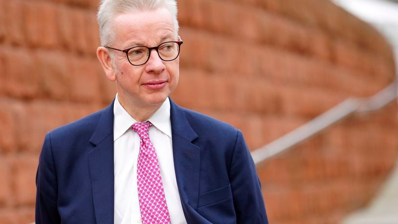 FILE - Then-Secretary of State Michael Gove arrives at the Conservative Party annual conference at Manchester Central convention complex in Manchester, England, Wednesday, Oct. 4, 2023. (AP Photo/Jon Super, File)