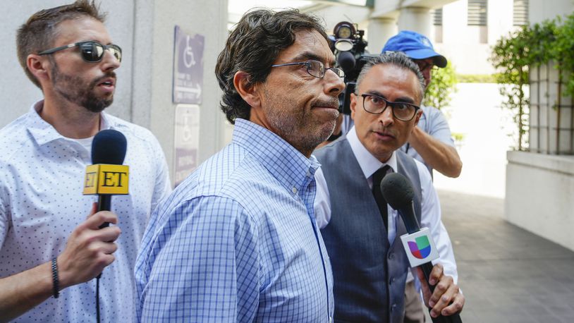 FILE - Dr. Mark Chavez, center, a physician from San Diego, who is charged in connection with actor Matthew Perry's death from an accidental ketamine overdose, arrives at the Roybal Federal Courthouse in Los Angeles, Friday, Aug. 30, 2024. (AP Photo/Damian Dovarganes, File)