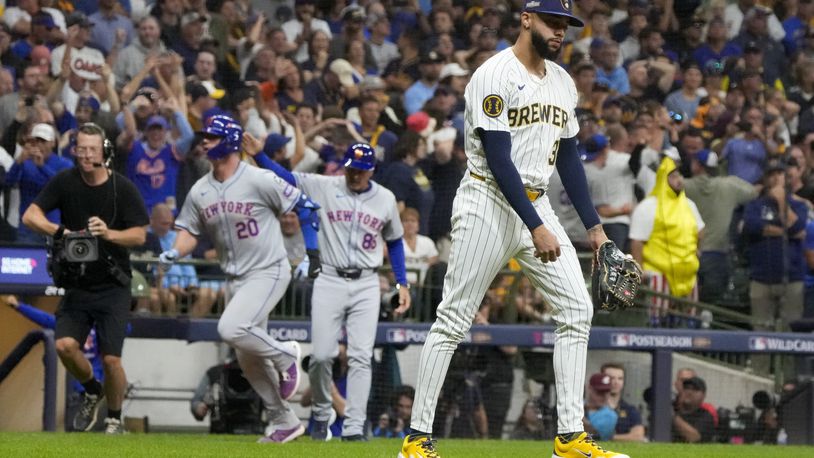 Milwaukee Brewers pitcher Devin Williams reacts after giving up a three-run home run to New York Mets' Pete Alonso during the ninth inning of Game 3 of a National League wild card baseball game Thursday, Oct. 3, 2024, in Milwaukee. (AP Photo/Morry Gash)