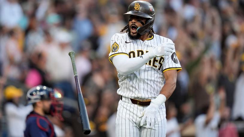 San Diego Padres' Fernando Tatis Jr. tosses his bat after hitting a two-run home run during the first inning in Game 1 of an NL Wild Card Series baseball game against the Atlanta Braves, Tuesday, Oct. 1, 2024, in San Diego. (AP Photo/Gregory Bull)