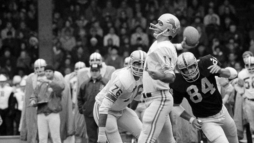 FILE - Detroit Lions quarterback Greg Landry looks for Chuck Walton somewhere downfield during an NFL football game against the Oakland Raiders in Detroit, Nov. 26, 1970. (AP Photo/JMC, File)