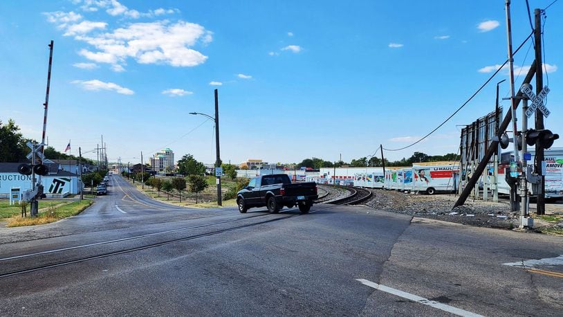 The Ohio Department of Transportation plans to improve the railroad crossing and intersection at Ohio 4 and Maple Avenue. This will includes improving signalization and pre-emption devises, and removing two legs of the pedestrian crosswalk and relocating them west on Maple. The $1 million project could begin as early as May 2025, but the completion deadline is Nov. 1, 2025, according to ODOT. Pictured is the Norfolk Southern railroad crossing on Maple Avenue at Ohio 4 on Monday, Sept. 16, 2024. NICK GRAHAM/STAFF