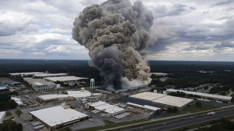 Smoke billows from a fire at the BioLab facility in Conyers, Ga., Sunday, Sept. 29, 2024. (Ben Gray/Atlanta Journal-Constitution via AP)