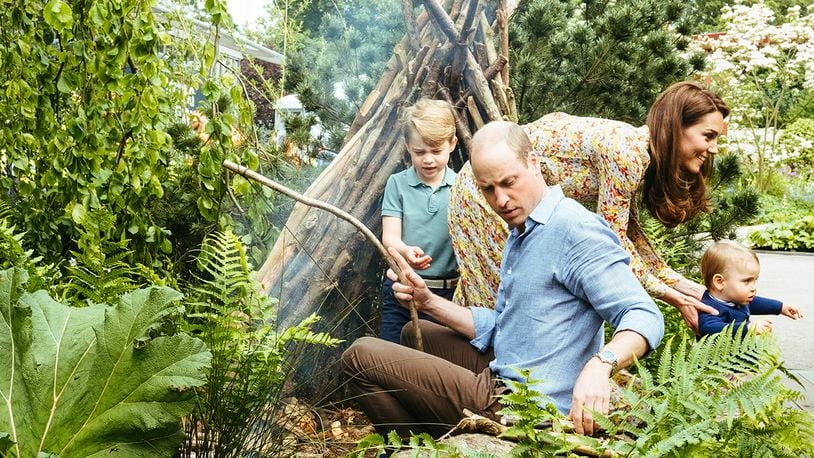 In this image made available on Sunday May 19, 2019 by Kensington Palace, Britain's Prince William, Kate, Duchess of Cambridge and their children, Prince George, Princess Charlotte and Prince Louis play in a garden co-designed by Kate Middleton, Adam White and Andree Davies ahead of the RHS Chelsea Flower Show in London.