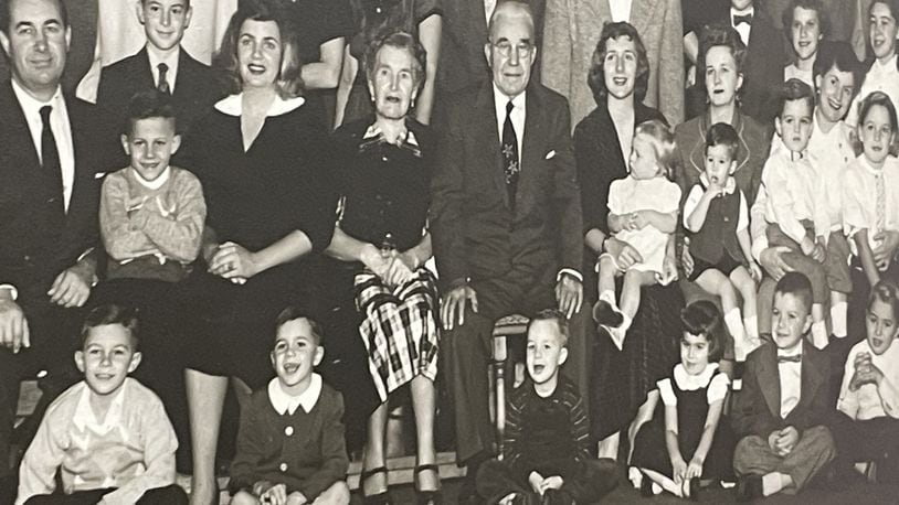 George Walther, Sr., started the Dayton Steel Foundry more than 100 years ago. He is seen here near the middle with a suit and tie surrounded by employees and family members in a photo taken in the 1950s. NICK BLIZZARD/STAFF