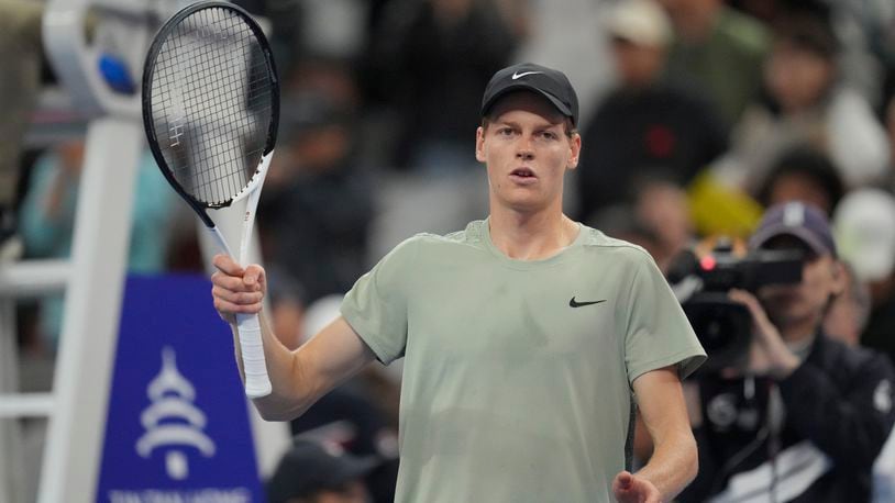 Italy's Jannik Sinner celebrates defeating China's Bu Yunchaokete in the China Open tennis tournament men's singles semi-final match, at the National Tennis Center in Beijing, Tuesday, Oct. 1, 2024.(AP Photo/Achmad Ibrahim)