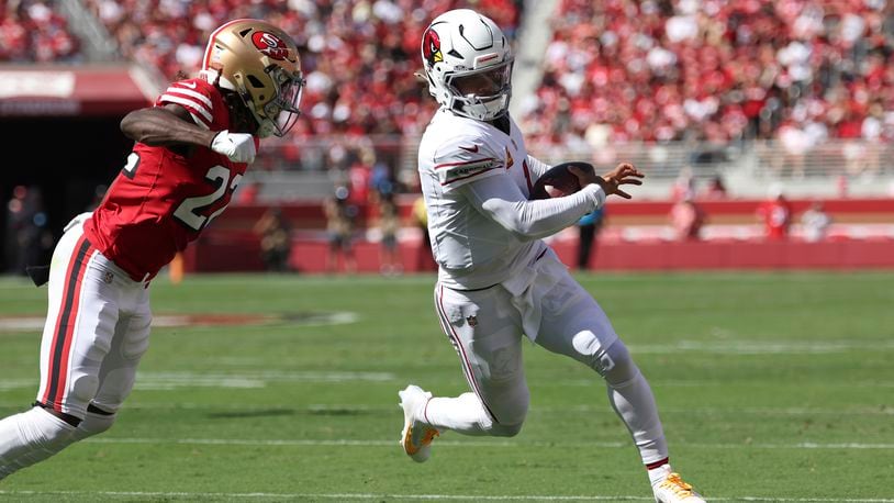 Arizona Cardinals quarterback Kyler Murray, right, runs against San Francisco 49ers cornerback Isaac Yiadom during the first half of an NFL football game in Santa Clara, Calif., Sunday, Oct. 6, 2024. (AP Photo/Jed Jacobsohn)