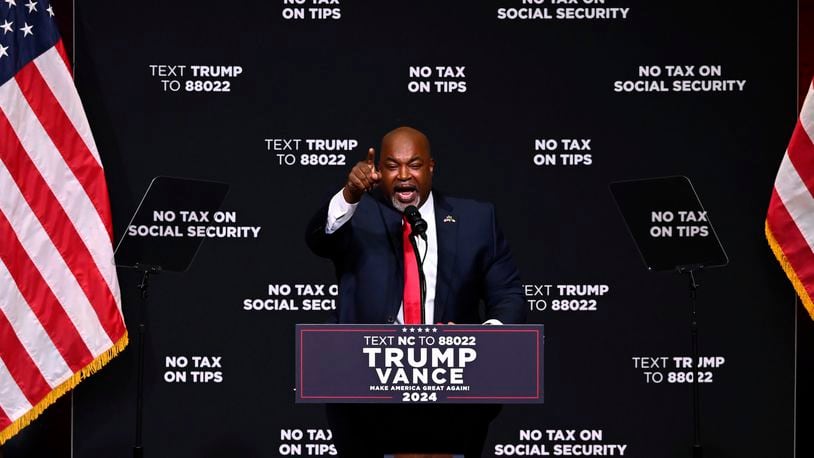 FILE - North Carolina Republican gubernatorial candidate Lt. Gov. Mark Robinson speaks before Republican presidential nominee former president Donald Trump in Asheville, N.C., Aug. 14, 2024. (AP Photo/Matt Kelley, File)