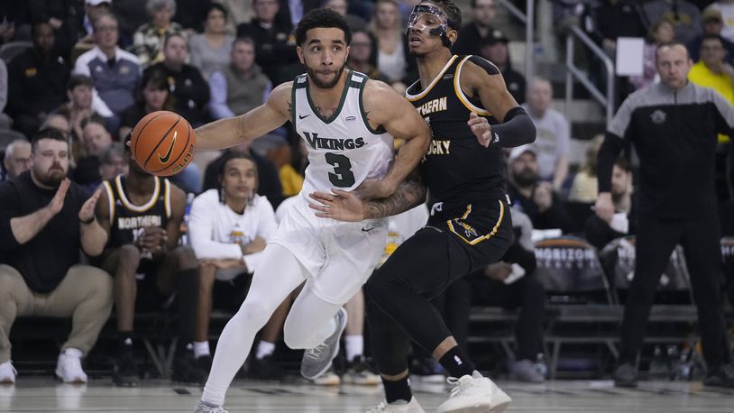 Cleveland State's Deshon Parker (3) goes to the basket against Northern Kentucky's Chris Brandon during the first half of an NCAA college basketball game for the Horizon League men's tournament championship Tuesday, March 7, 2023, in Indianapolis. (AP Photo/Darron Cummings)