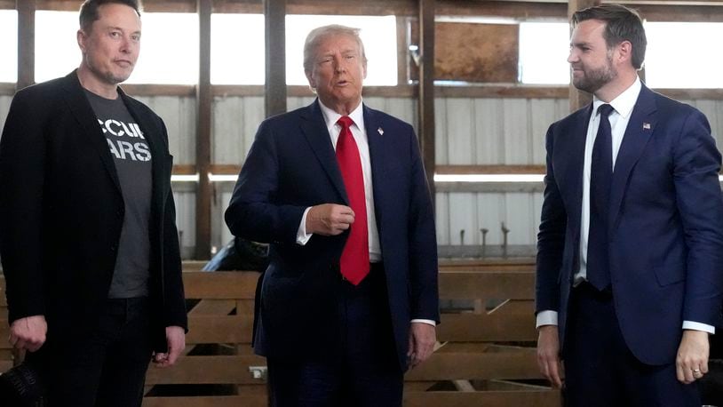 Tesla and SpaceX CEO Elon Musk, from left, Republican presidential nominee former President Donald Trump and Republican vice presidential nominee Sen. JD Vance, R-Ohio, attend a campaign event at the Butler Farm Show, Saturday, Oct. 5, 2024, in Butler, Pa. (AP Photo/Alex Brandon)