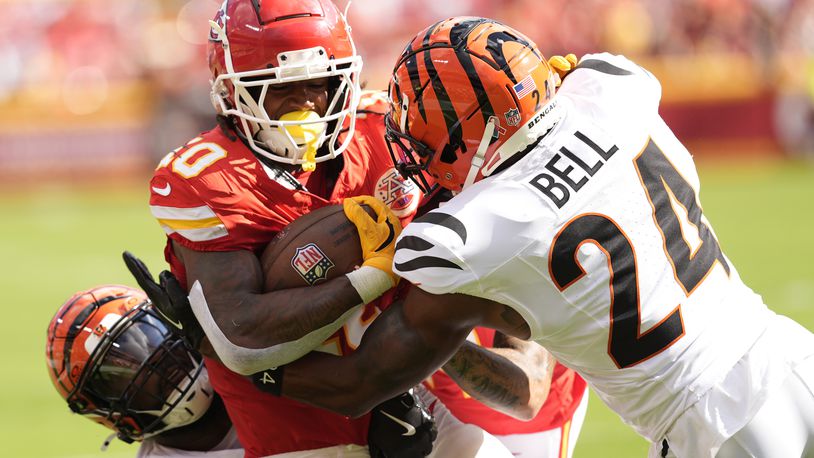 Kansas City Chiefs running back Isiah Pacheco (10) is stopped by Cincinnati Bengals safety Vonn Bell (24) during the first half of an NFL football game Sunday, Sept. 15, 2024, in Kansas City, Mo. (AP Photo/Charlie Riedel)