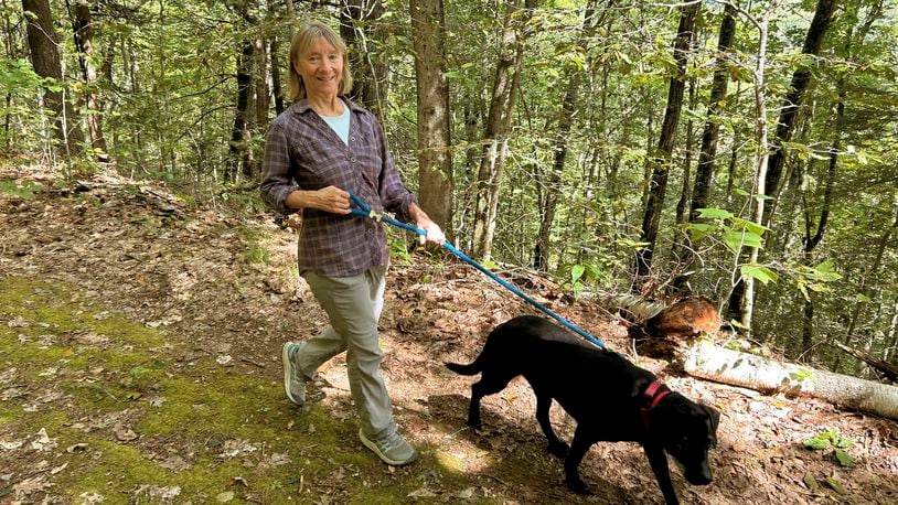 Susannah Johnston, of Croton-on-Hudson, N.Y., walks her dog. Johnston on Sept. 8, 2024. Johnston, a fit yoga instructor and strength trainer, has been injured three times in incidents involving walking her dog. (Vincent Cohan via AP)