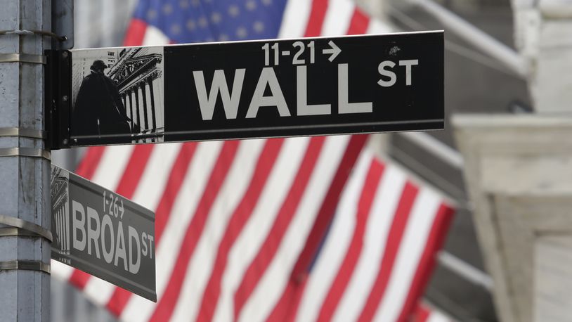 FILE - Signs marking the intersection of Broad and Walls Streets appear near the New York Stock Exchange on Oct. 1, 2024, in New York. (AP Photo/Peter Morgan, File)