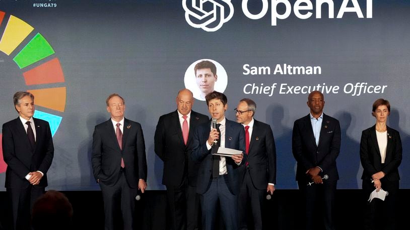 FILE - Open AI Chief Executive Officer Sam Altman, center, speaks at the Advancing Sustainable Development through Safe, Secure, and Trustworthy AI Event on Sept. 23, 204, in New York. (Bryan R. Smith/Pool Photo via AP, File)