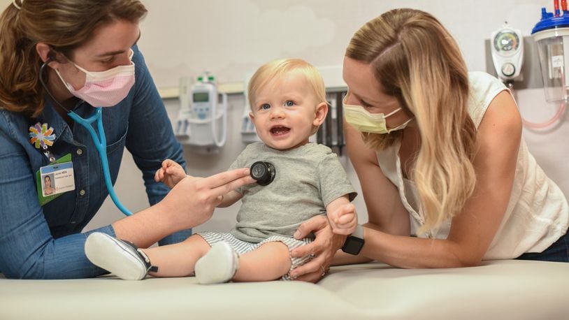 FILE - A doctor exams a patient at Dayton Children's Hospital. Dayton Children's has been seeing a gradual increase in COVID cases, but is expecting a winter wave of respiratory illnesses. Dayton Children's recommends infants get vaccinated against RSV this fall in order to prevent serious illness from RSV. COURTESY OF DAYTON CHILDREN'S HOSPITAL