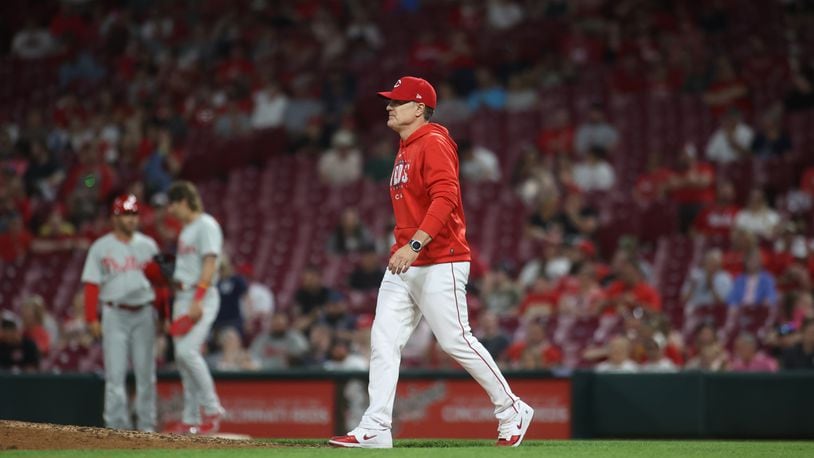 Reds manager David Bell walks to the mound in the ninth inning against the Phillies on Thursday, April 13, 2023, at Great American Ball Park in Cincinnati. David Jablonski/Staff