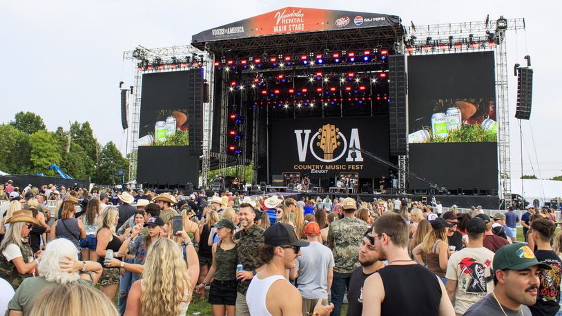 Concert goers attend the first day of the Voices of America Country Music Fest on the grounds of the National Voice of American Museum of Broadcasting Thursday, Aug. 8, 2024 in West Chester Township. KASEY TURMAN/STAFF