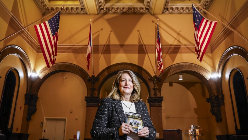 Karen Minnelli Holcomb, daughter-in-law of longtime Butler County Prosecutor John Holcomb, has released a book written from Holcomb's prosecution of the nationally notorious mass murder case of James Ruppert who killed his whole family in Hamilton on Easter Sunday 1975. NICK GRAHAM/STAFF