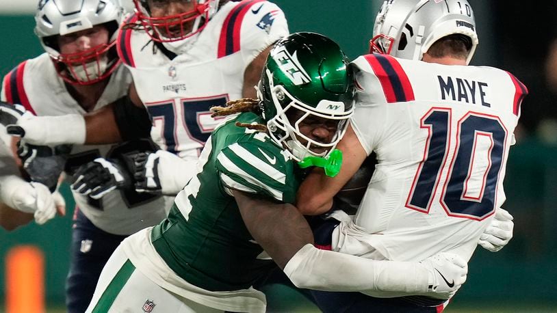 New York Jets linebacker Jamien Sherwood (44) sacks New England Patriots quarterback Drake Maye (10) during the fourth quarter of an NFL football game, Thursday, Sept. 19, 2024, in East Rutherford, N.J. (AP Photo/Seth Wenig)