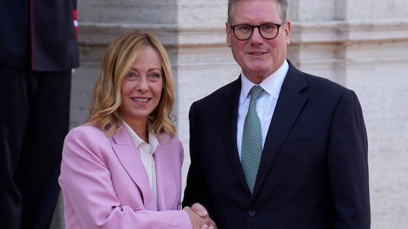 Italian Premier Giorgia Meloni, left, welcomes U.K. Prime Minister Keir Starmer as they meet at Villa Panphilj in Rome, Monday, Sept. 16, 2024. U.K. Prime Minister Keir Starmer is meeting Italian Premier Giorgia Meloni in Rome on Monday, as the two very different politicians, from left and right, seek common cause to curb migrants reaching their shores by boat. The visit comes after at least eight seaborne migrants died off the French coast over the weekend. (AP Photo Andrew Medichini)