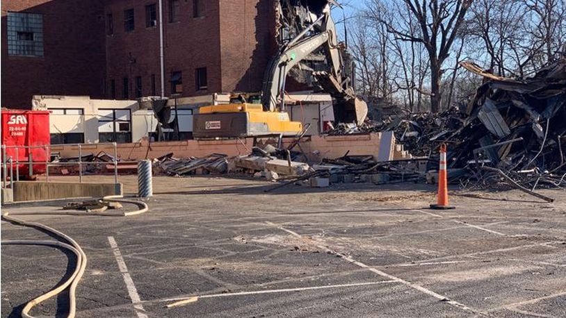 A crew from Green City Demolition works at demolishing the southeast corner of Franklin Junior High School on Wednesday. The 100-year-old building is being torn down to make way for the new Franklin High School campus. The demolition is expected to be completed by early January. ED RICHTER/STAFF