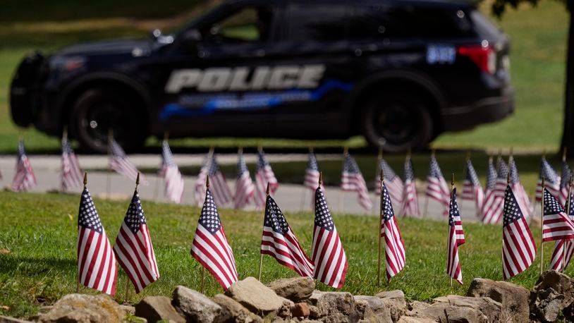 FILE - Police watch over the site of a visitation for Corey Comperatore at Laube Hall, July 18, 2024, in Freeport, Pa. Comperatore was killed at rally for former President Donald Trump Saturday. (AP Photo/Eric Gay, File)