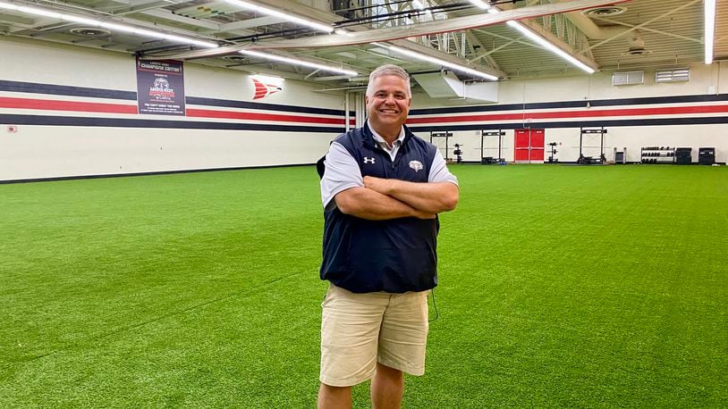 For the first time in Lakota Schools’ history some of its teenage student athletes and gym students can now train and exercise on an indoor synthetic turf practice field. The recently installed turf at Lakota West High School is part of a renovation of a former auxiliary gym – known as the school’s upper gym - next to the West Chester Twp.’s school main sports arena. Pictured is West Athletic Director Scott Kaufman. (Photo By Michael D. Clark/ Journal-News)