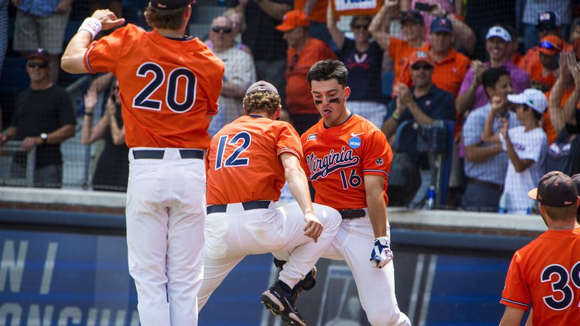 Virginia's Anthony Stephan (16) celebrates after scoring against Duke during an NCAA college baseball tournament super regional game on Sunday, June 11, 2023, in Charlottesville, Va. (AP Photo/John C. Clark)