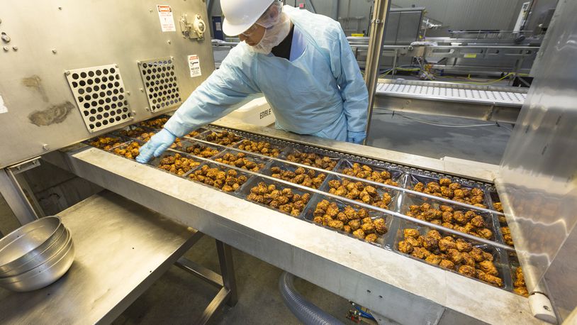 A SugarCreek employee works a production line at the company’s facility at 4235 Thunderbird Lane in West Chester Twp. CONTRIBUTED