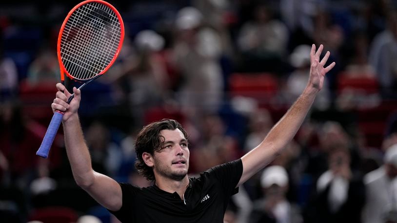 Taylor Fritz of the United States waves to spectators after defeating Terence Atmane of France in the men's singles second round match in the Shanghai Masters tennis tournament at Qizhong Forest Sports City Tennis Center in Shanghai, China, Monday, Oct. 7, 2024. (AP Photo/Andy Wong)