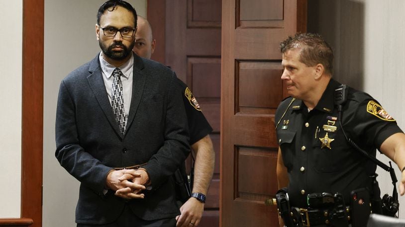 A 3-judge panel of Butler County judges Keith Spaeth, left, Gregory Howard, center, and Greg S. Stephens sentence Gurpreet Singh to death Tuesday, May 14, 2024 in Butler County Common Pleas Court in Hamilton. Gurpreet Singh was found guilty on all counts in for killing 4 members of his family in 2019 in West Chester Township. NICK GRAHAM/STAFF