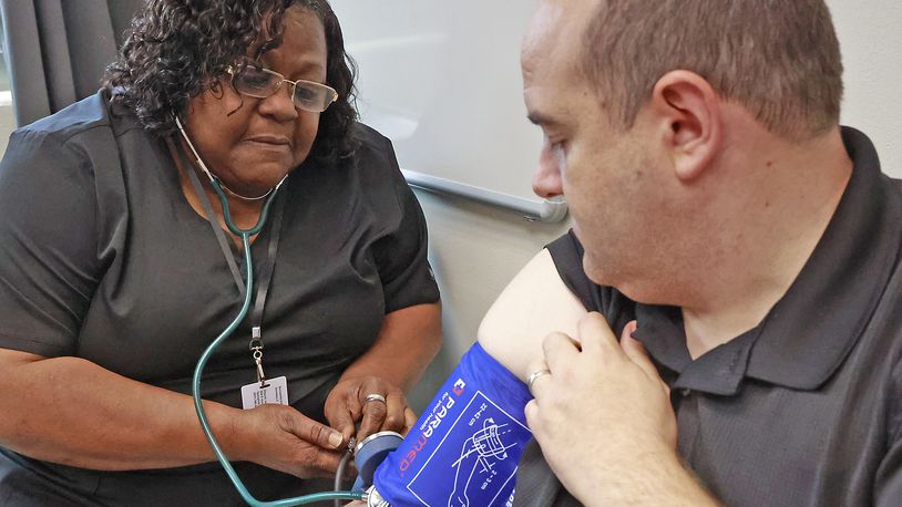 File - Paden Frank gets his blood pressure taken by Bernadette Kidd at the Clark County Combined Health District Monday, June 26, 2023. Blood pressure, along with topics of cholesterol and strep throat, were among some of the top trending health-related questions last year. BILL LACKEY/STAFF