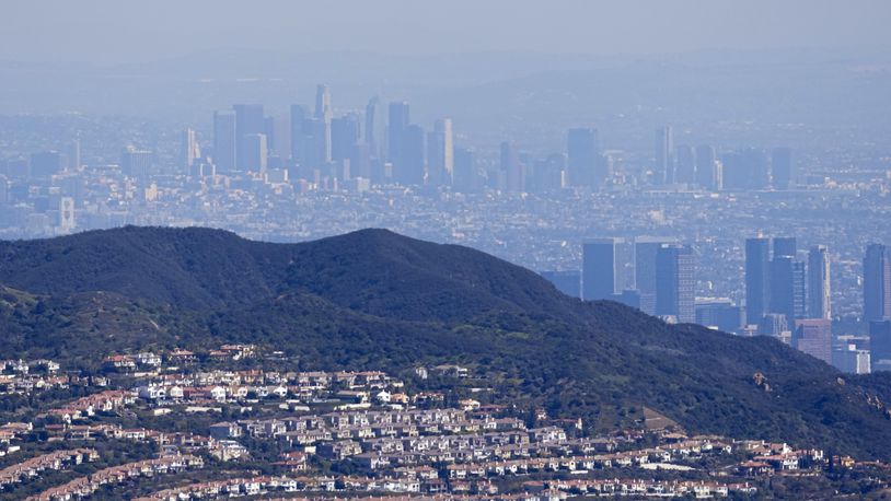 FILE - Downtown Los Angeles, above, is seen from the Topanga area of Los Angeles with the Century City area in the lower right Thursday, March 2, 2023. (AP Photo/Mark J. Terrill, File)