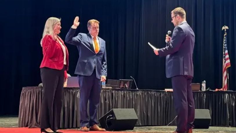 Lakota Schools Treasurer Adam Zink, right, swears in new Lakota Board of Education President Julie Shaffer and newly elected board member Doug Horten during a recent, first meeting of school board in 2024. Local school boards that help oversee millions of dollars of taxpayer funds spent on the operations of public school recently conducted the annual process of voting on presidents and vice presidents of their governing bodies. CONTRIBUTED