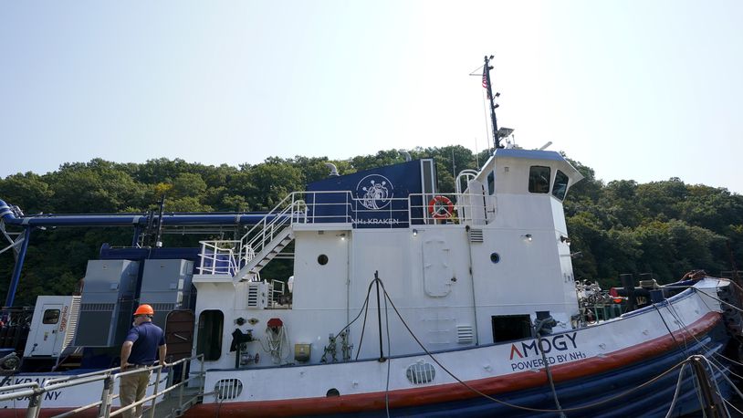 A worker stands near the NH3 Kraken, a tugboat powered by ammonia, on Friday, Sept. 13, 2024, in Kingston, N.Y. (AP Photo/Alyssa Goodman)