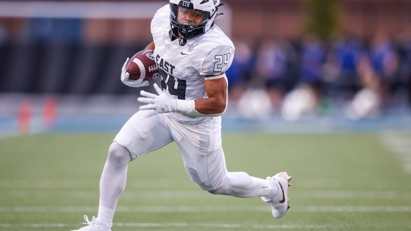 Lakota East's Ryder Hooks carries the ball during their football game Friday, Sept. 6, 2024 at Hamilton's Virgil M. Schwarm Stadium. Lakota East won 27-24 in overtime. NICK GRAHAM/STAFF