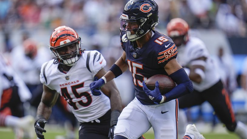 Chicago Bears wide receiver Rome Odunze (15) runs with the ball against Cincinnati Bengals linebacker Maema Njongmeta (45) during the first half of an NFL preseason football game, Saturday, Aug. 17, 2024, at Soldier Field in Chicago. (AP Photo/Erin Hooley)