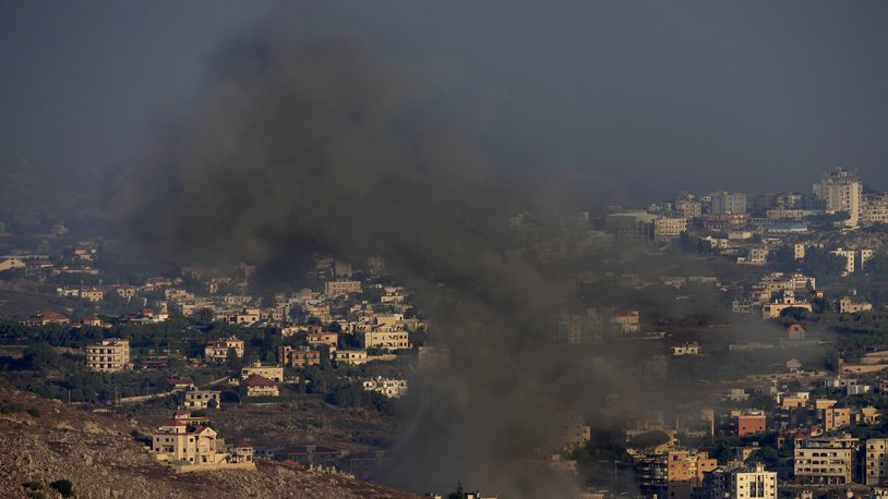 Smoke rises from an Israeli airstrike on Kfar Rouman village, as seen from Marjayoun town, south Lebanon, Monday, Sept. 23, 2024. (AP Photo/Hussein Malla)