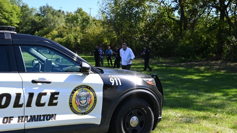 Pictured is Hamilton Superintendent Mike Holbrook leaving walking toward the Garfield Middle School parking lot after a report of a body was found Thursday afternoon, Oct. 3, 2024, in a wooded area next to the school's property. MICHAEL D. PITMAN/STAFF