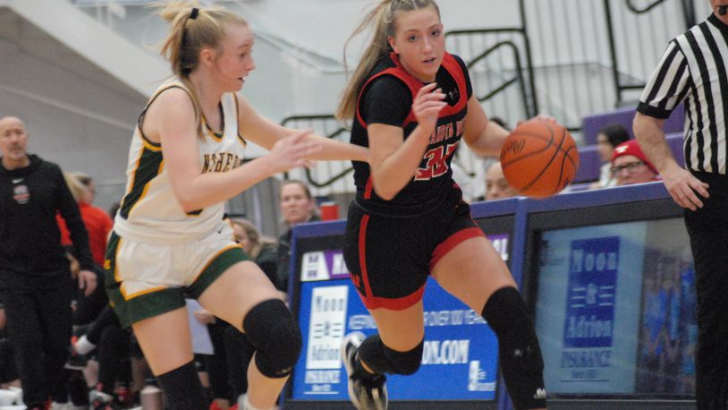 Lakota West's Katie Fox drives past Little Miami's Emily Bayles on Wednesday night. Chris Vogt/CONTRIBUTED