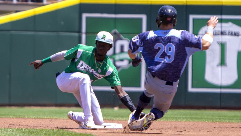 Dragons shortstop Elly De La Cruz tags out West Michigan's Ben Malgeri on a steal attempt on a throw from catcher Mat Nelson during Sunday's game at Dayair Ballpark.