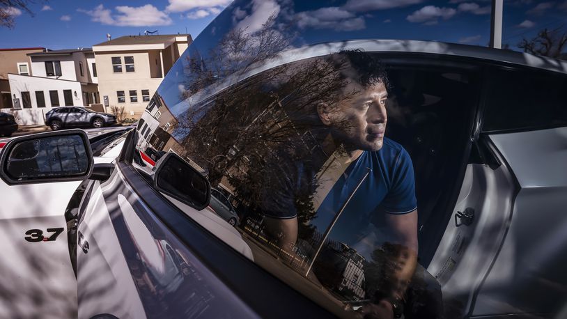 Carlos Sandoval-Smith, who detailed his encounters with an Albuquerque police officer and a law firm implicated in a DWI corruption probe, poses in Albuquerque, N.M., Thursday, Feb. 23, 2024. (Chancey Bush/The Albuquerque Journal via AP)