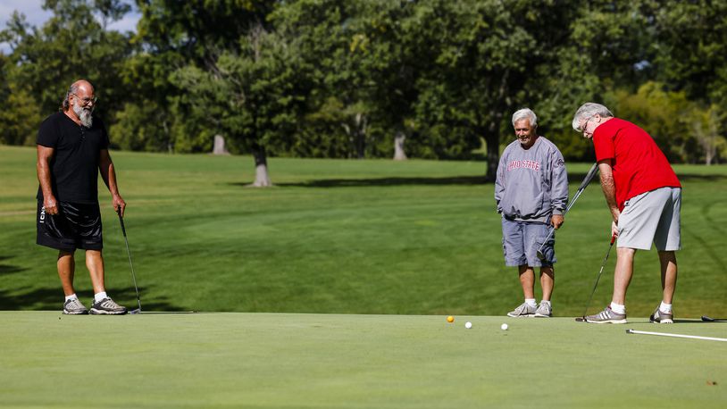 Kent Stevens, left, Ron Reece, middle, and Dave 
Luff golf at Potters Park Golf Course in Hamilton. NICK GRAHAM/STAFF