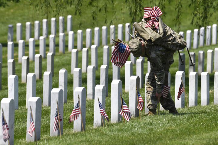 Soldiers place flags at Arlington National Cemetery for Memorial Day